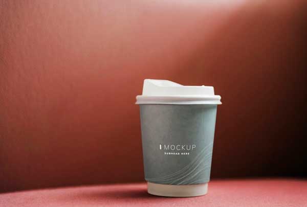 Coffee Cup Mockup in Red Backdrop Free Psd