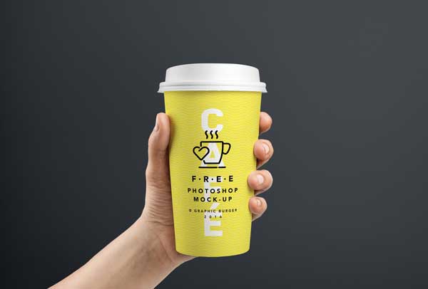Free Coffee Cup In Hand MockUp