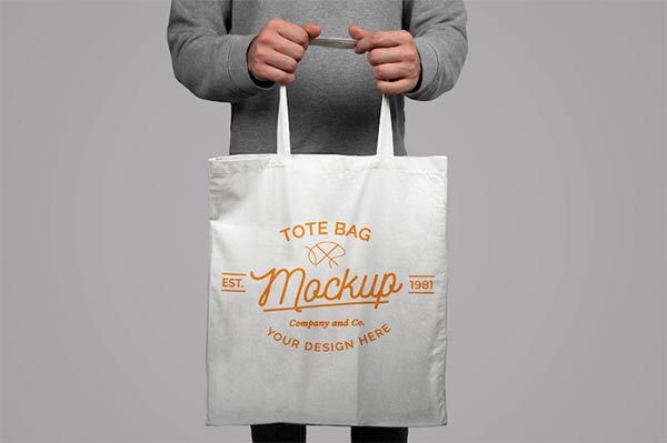 Model Holding Free Tote Bag Free Mockup